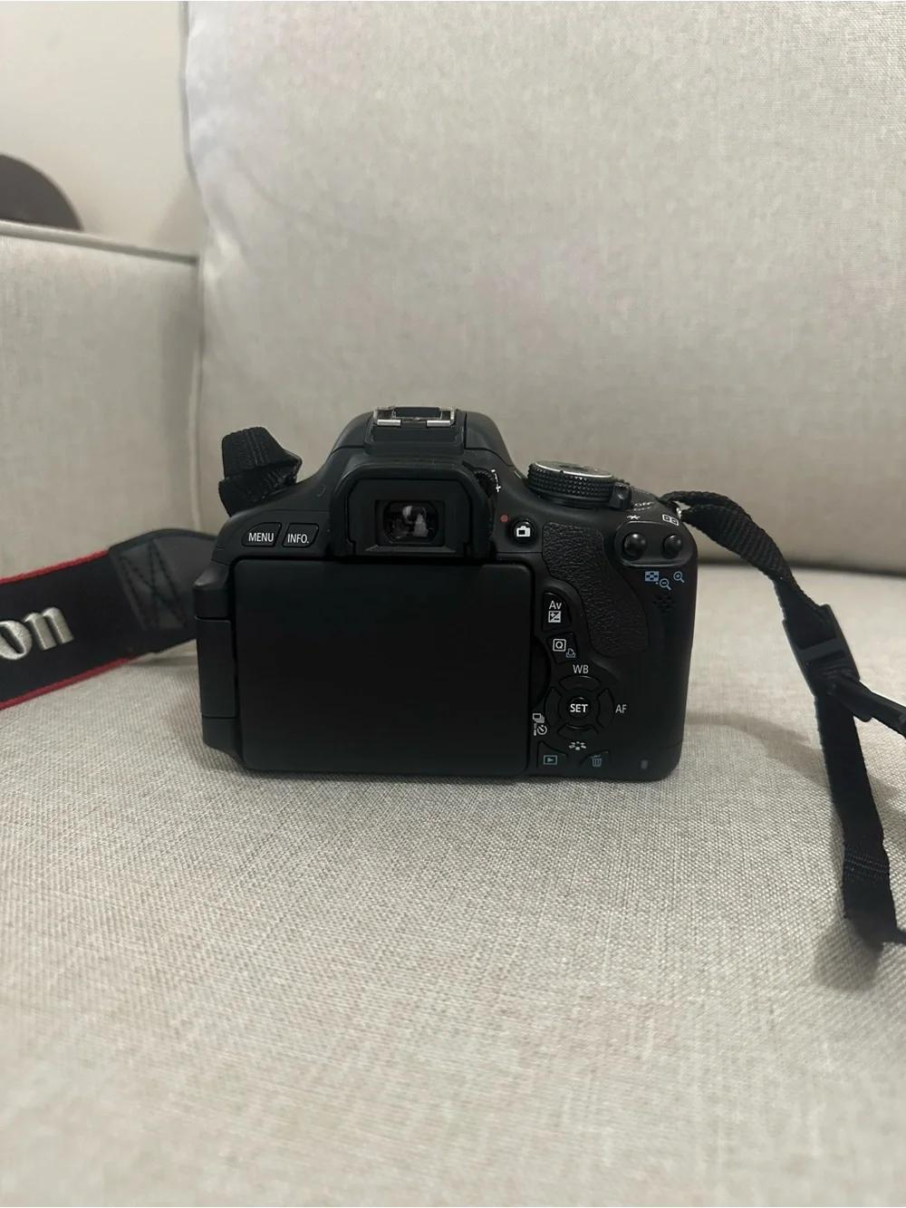 Canon DSLR Camera in Black with Red-Trim Strap